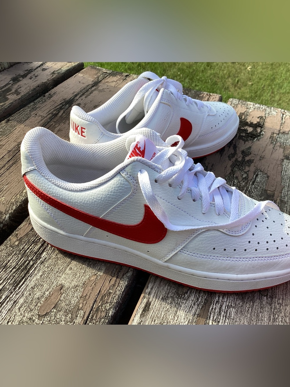 Nike White Low-Top Sneakers with Red Swoosh and Red Accents